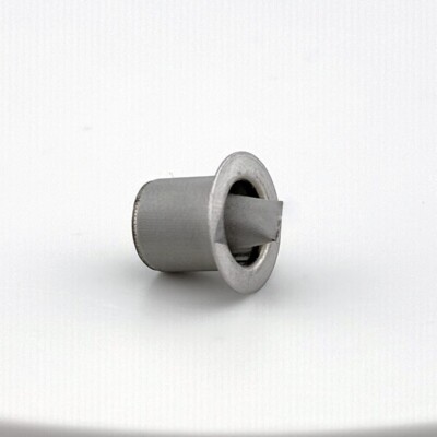 A small cylindrical metal component with a flange and an angled tab on a plain white background.